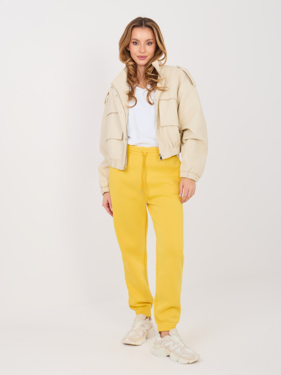 Żółte spodnie dresowe z wysokim stanem i kieszeniami