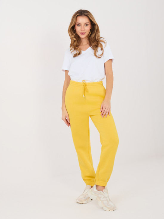 Żółte spodnie dresowe z wysokim stanem i kieszeniami