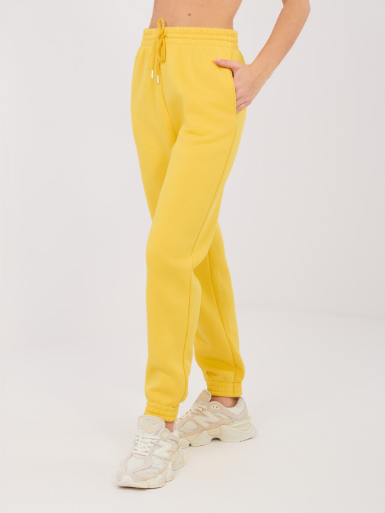 Żółte spodnie dresowe z wysokim stanem i kieszeniami