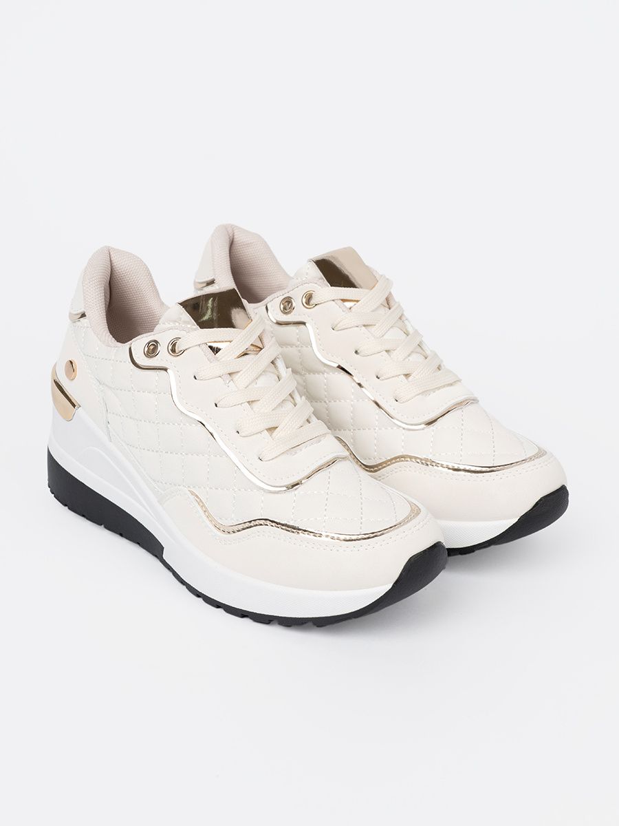 Beżowe sneakersy z połyskującymi złotymi akcentami