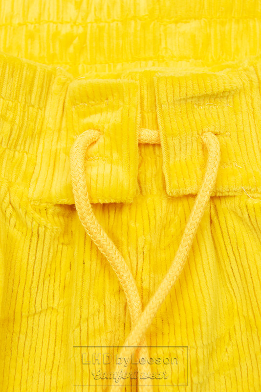 Żółte spodnie z troczkami w pasie