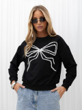 Elegancka czarna bluza z aplikacją