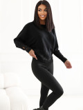 Elegancki czarny sweter z koronką