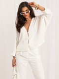 Elegancki sweter ecru z dekoltem w serek