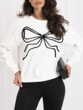 Elegancka bluza ecru z aplikacją