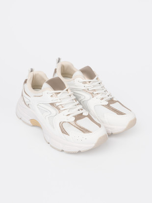 Białe sneakersy z beżowo-złotymi wstawkami